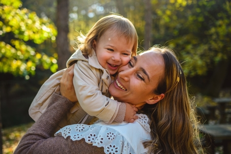 mother hugging her daughter