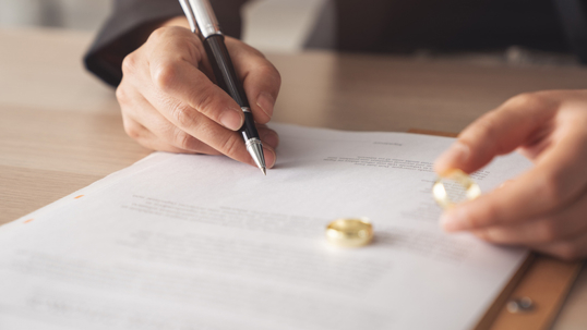 person signing divorce papers